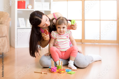 kid and mother play togethe...