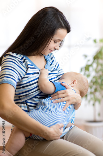 Young mother holding her ne...
