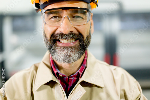Portrait of middle-aged engineer in factory
