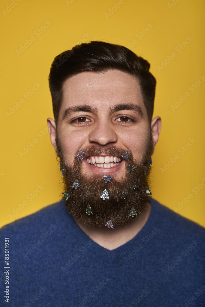 Portrait of smiling handsome man with stickers in beard Portrait of smiling handsome man with stickers in beard