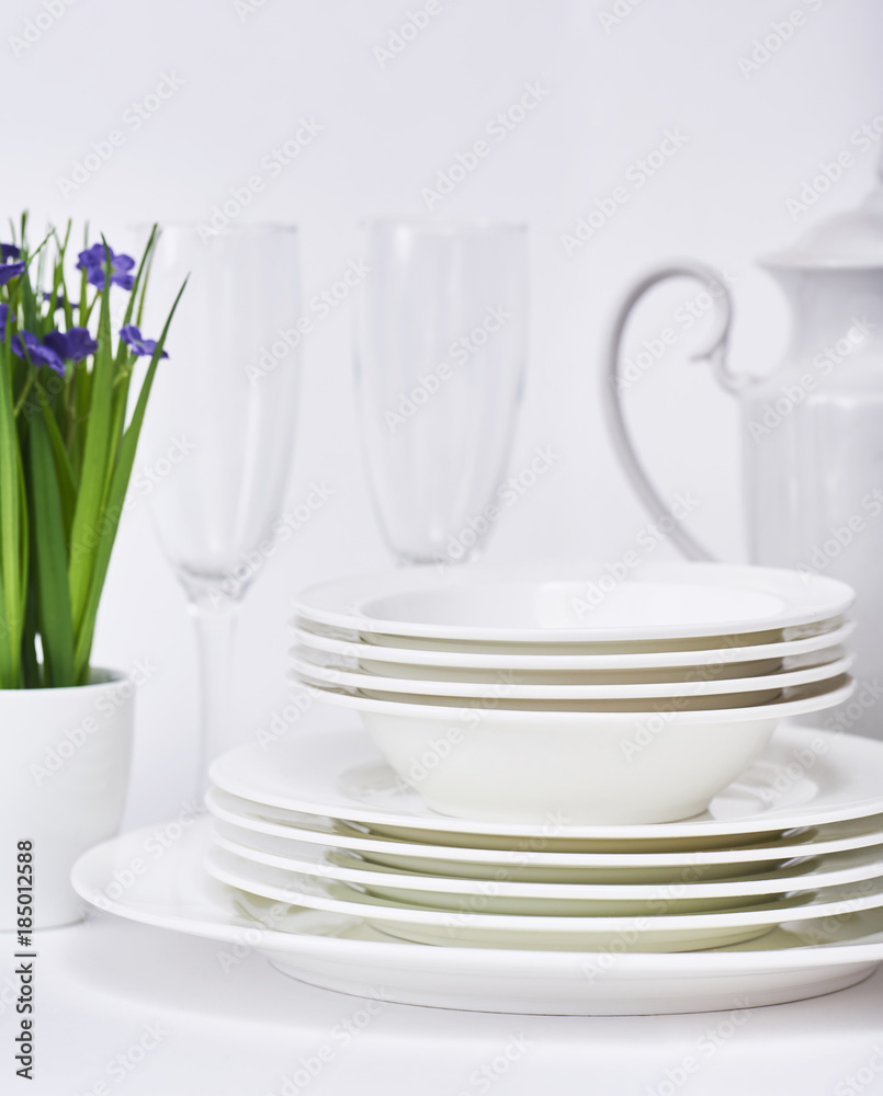 Set of new clean white dishes isolated on white background