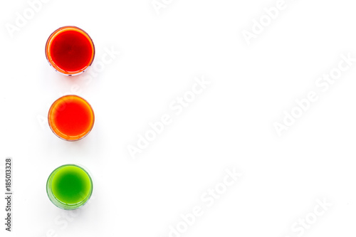 Fresh detox beverages with vegetables on white background top view copyspace