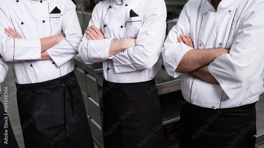 Φωτογραφία Contestants of a tv cooking talent show stand in a row ready to show their skills in the competition