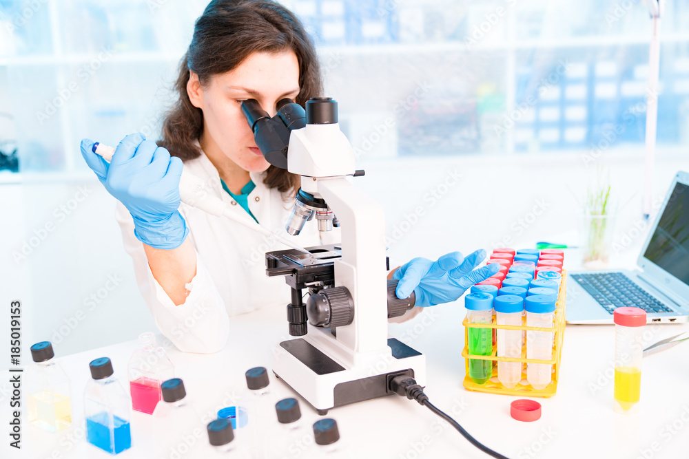 Young female technician in the laboratory of food quality control Young female technician in the laboratory of food quality control
