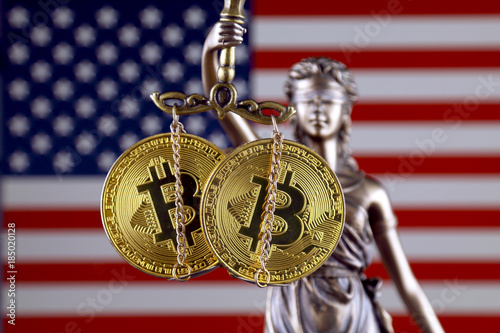 Symbol of law and justice, physical version of Bitcoin and United States Flag. Prohibition of cryptocurrencies, regulations, restrictions or security, protection, privacy.