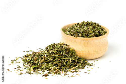 Green tea in wooden plate on white