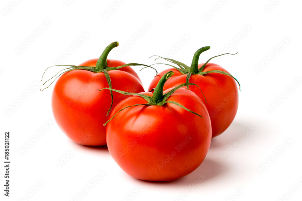Three ripe tomatoes on a white Three ripe tomatoes on a white