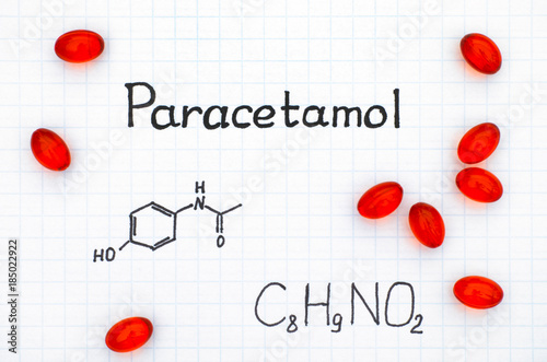 Chemical formula of Paracetamol and red pills. photo