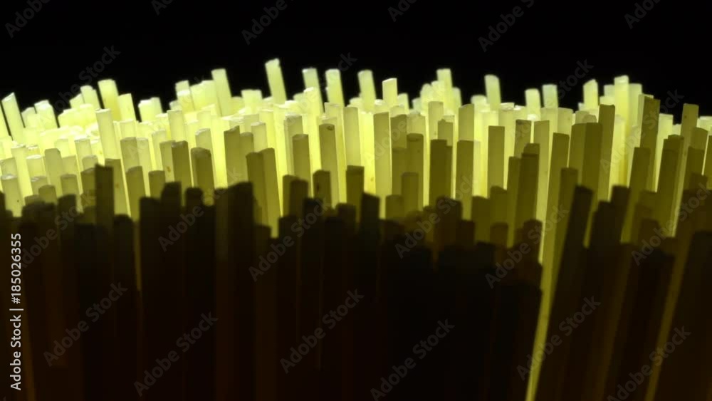 Yellow long dry spaghetti in rotation. Studio shot. Close Up. Macro Yellow long dry spaghetti in rotation. Studio shot. Close Up. Macro