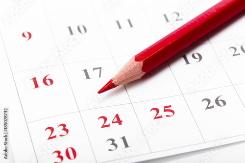 Check out the dates in a business calendar concept