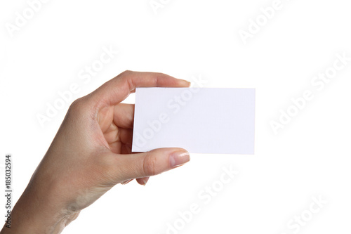 Female hand holding business card in office