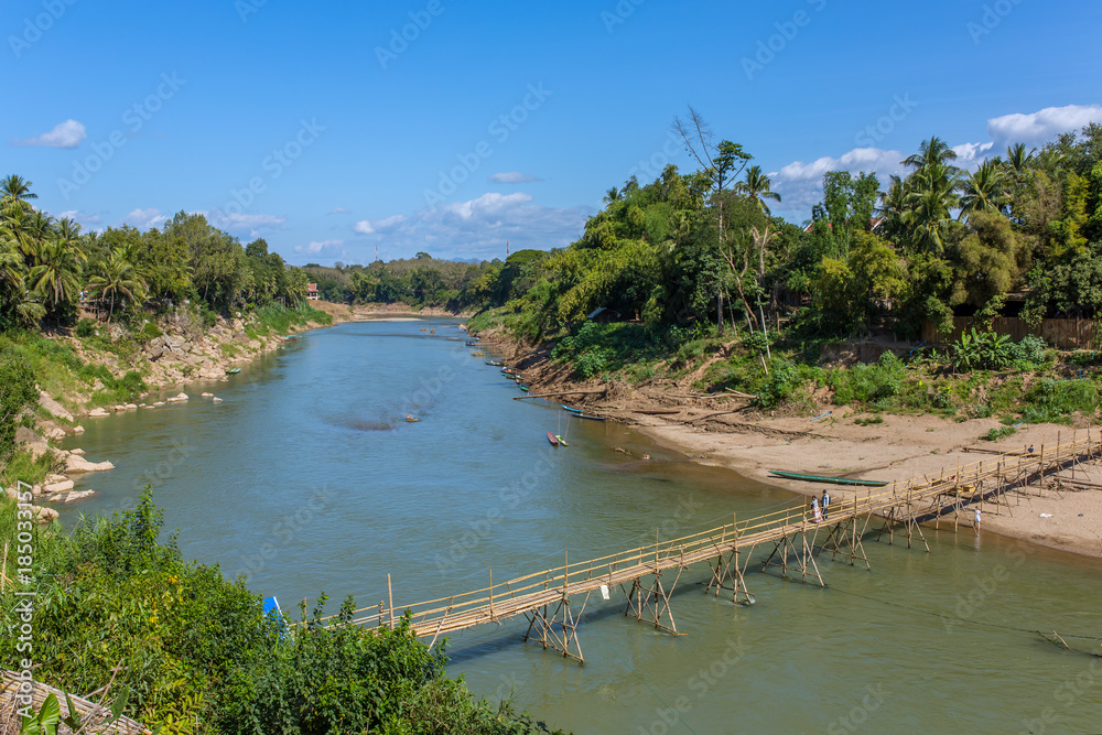 Wooden bridge over Nam khan rive in Luang Prabang, Laos