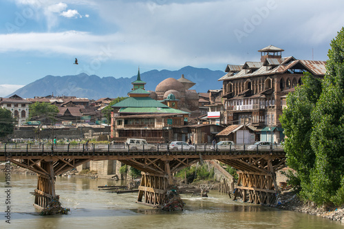 Riverside view of old town Srinagar from one of the bridges across Jhelum river, Jammu and Kashmir, India. photo