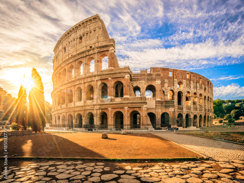 Colosseum at sunrise  Rome  Italy  Europe. Rome ancient arena of gladiator fights. Rome Colosseum is the best known landmark of Rome and Italy