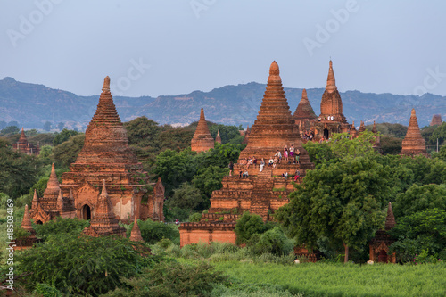 Bagan, Myanmar - October 11, 2016: Tourists watching sunrise climbed up at the ancient pagodas in Bagan, Myanmar.