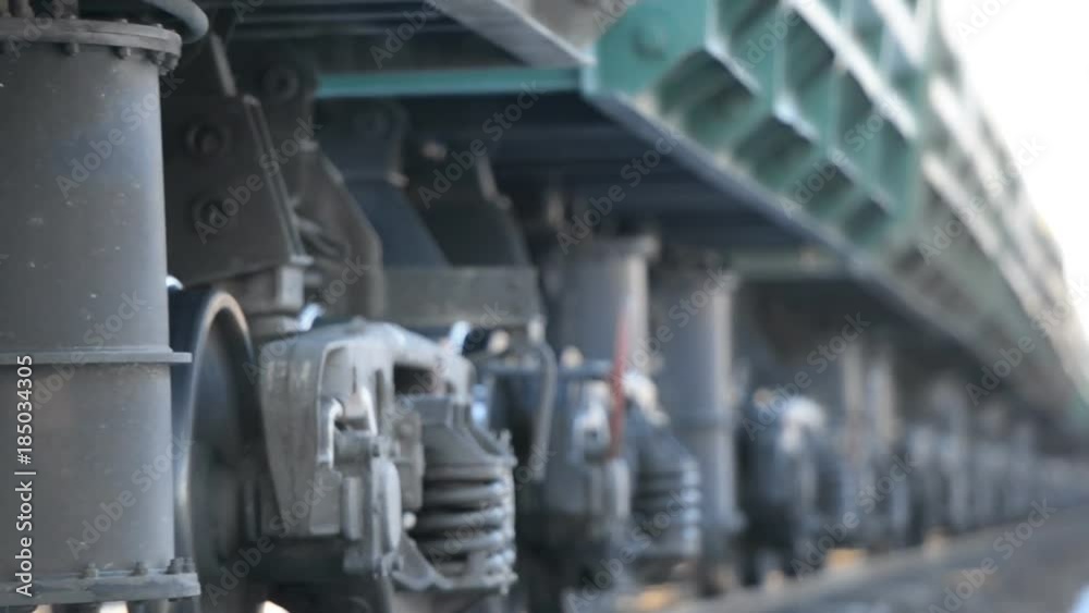 Close-up of a wheeled pair (wheeled cart) of a freight railway train Close-up of a wheeled pair (wheeled cart) of a freight railway train