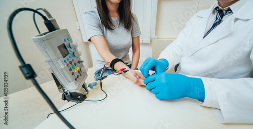 Patient nerves testing using electromyography. EMG