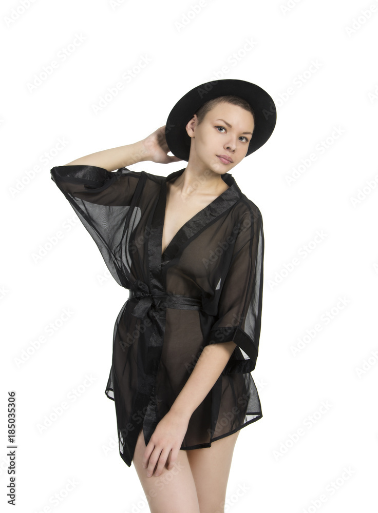 Beautiful young girl in black tunic and black hat. Beautiful young girl in black tunic and black hat.