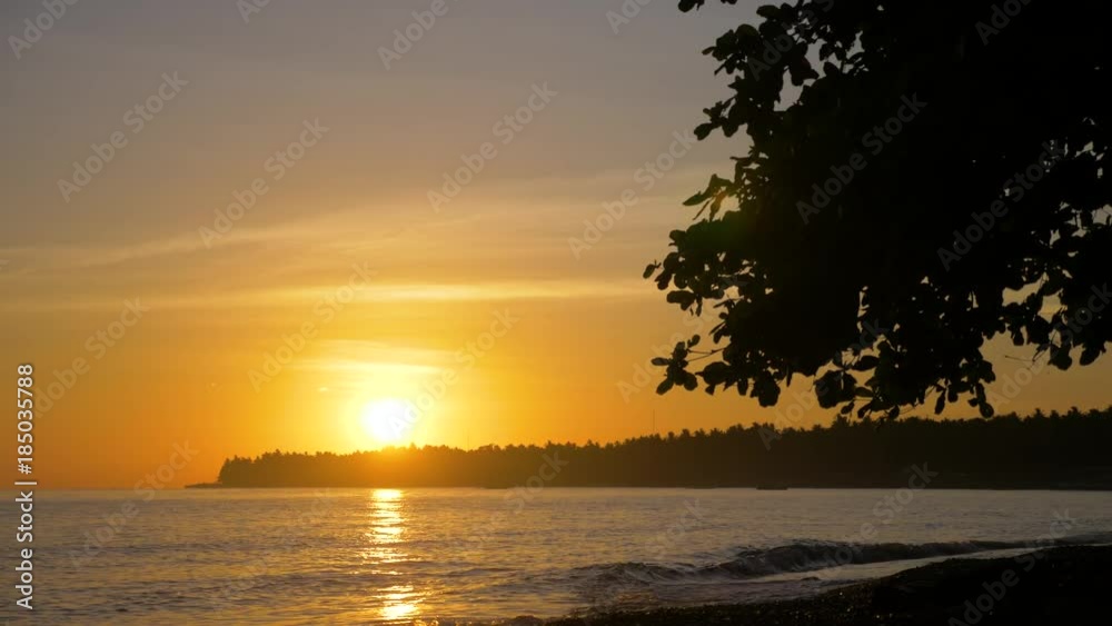 Sea coast at sunset. Aerial view of sunset on the ocean coast, sea, beach, sky, clouds. Bali, Indonesia. Sunset on the island of Bali. 4K Sea coast at sunset. Aerial view of sunset on the ocean coast, sea, beach, sky, clouds. Bali, Indonesia. Sunset on the island of Bali. 4K