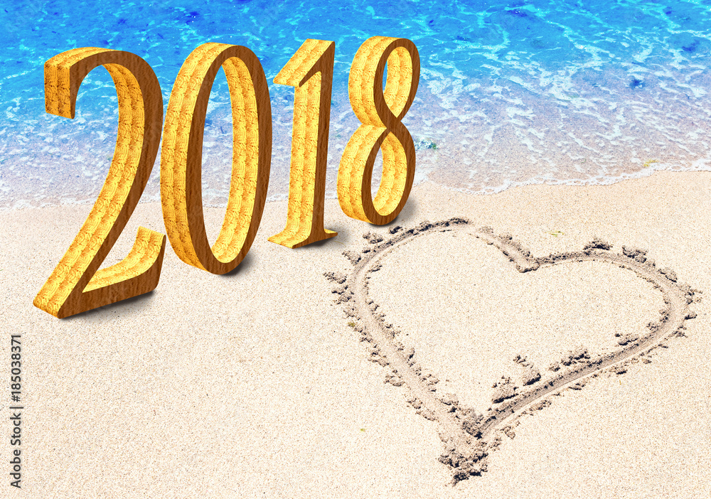 New Year inscription 2018 and heart is drawn on sand on the beach..