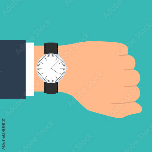 Wristwatch on the hand of businessman in suit. Time on wrist watch. Man with clock checks the time. Hand with clock isolated on background.