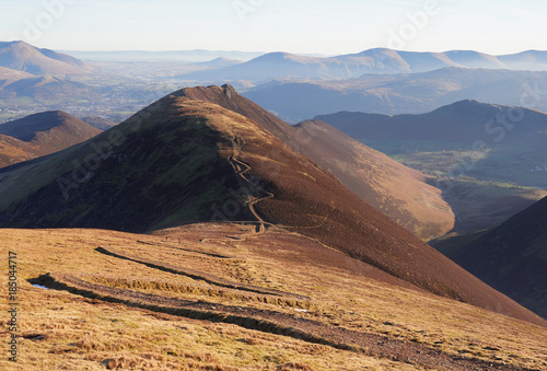 The winding path up to the summit of Sail and Scar Crags in the distance in the English Lake District, UK. photo