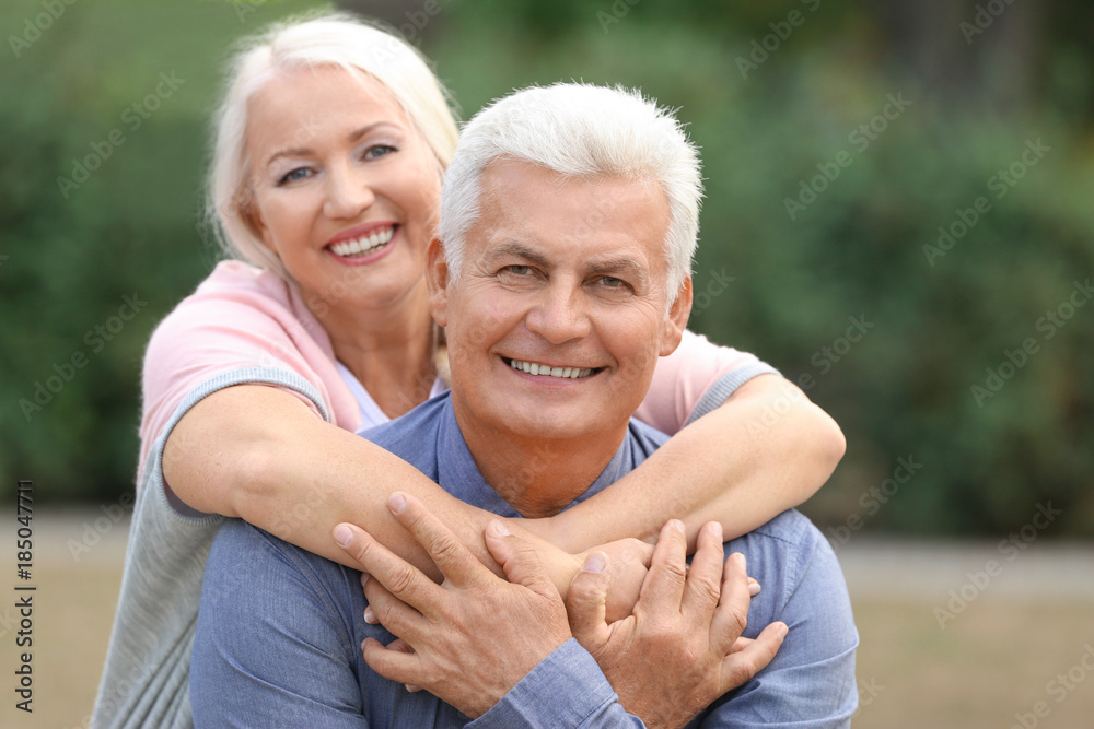 Mature couple together in park Mature couple together in park