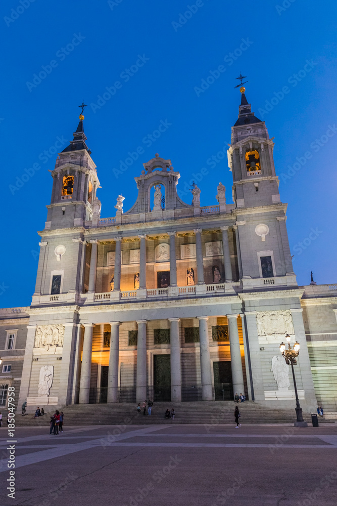 Almudena Cathedral at sunset, a Catholic church in Madrid, Spain. It is the seat of the Roman Catholic Archdiocese of Madrid. 