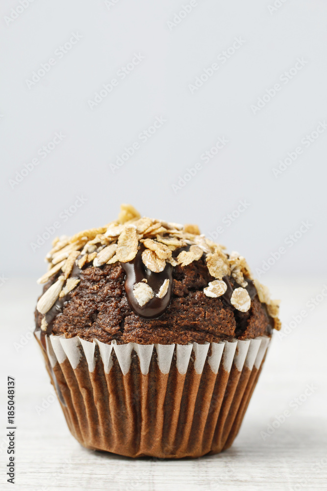 Chocolate muffin with oatmeal flakes. Chocolate muffin with oatmeal flakes.