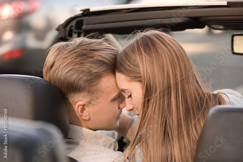 Happy young couple in moder...