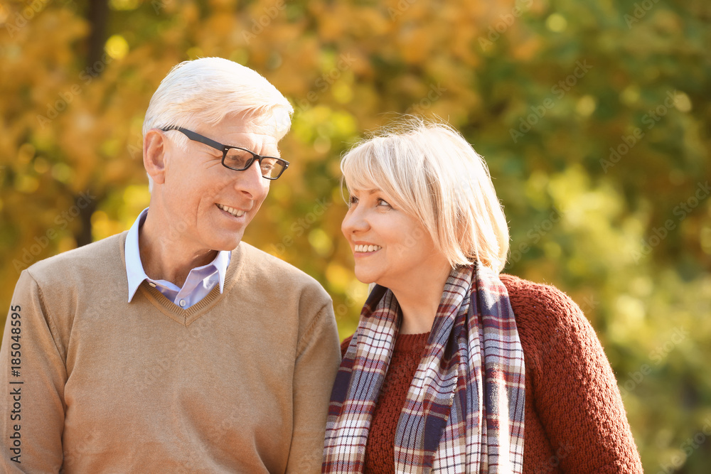 Cute elderly couple in autumn park Cute elderly couple in autumn park