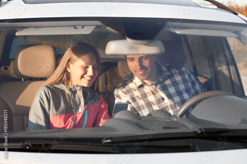 Beautiful young couple in car