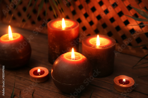 Many burning candles on table © Africa Studio