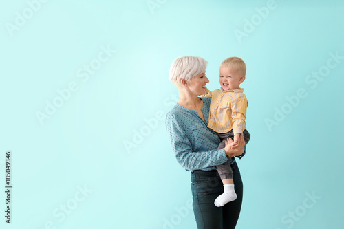 Young mother holding her ba...
