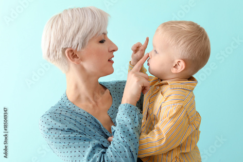 Young mother holding her ba...