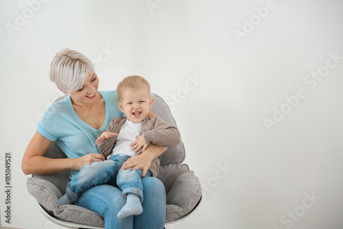 Young mother with her baby ...