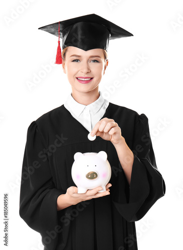 Young graduate putting coin...