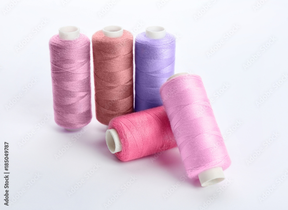 Colorful sewing threads on white background Colorful sewing threads on white background