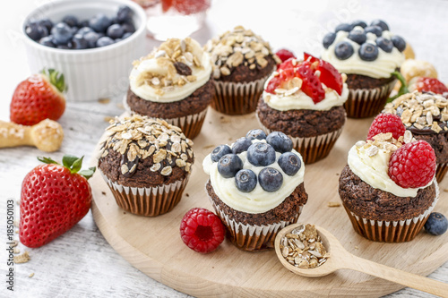 Muffins decorated with fresh fruits. Healthy snack.