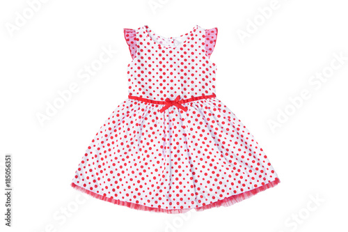 A girl dress in white color with red spots