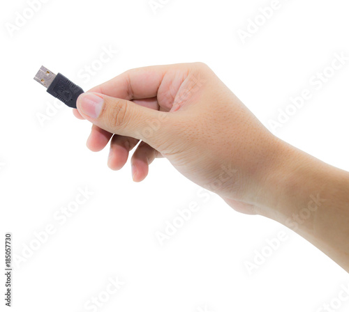 Hand holding black USB cable on white background