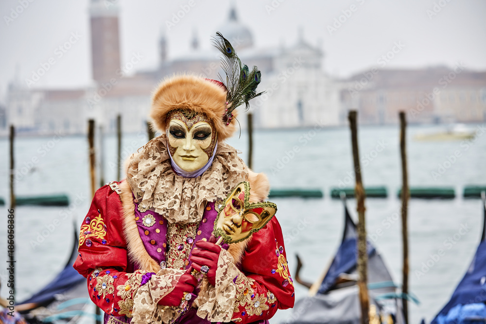 Venice carnival 2017. Venetian Carnival Costume. Venetian Carnival Mask. Venice, Italy.  Opposite San Giorgio