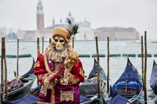 Venice carnival 2017. Venetian Carnival Costume. Venetian Carnival Mask. Venice, Italy.  Opposite San Giorgio © Ihor