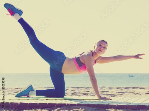Fitness woman is practicing set of stretching exercises