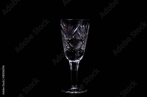The wine glass on black background