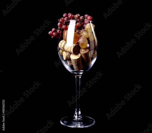 Wine glass grapes wine stopper, maple leaves in the smoke photo