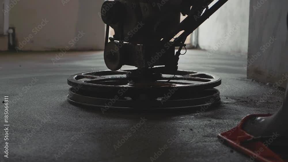 Mechanized grout screed concrete floor close-up slow motion