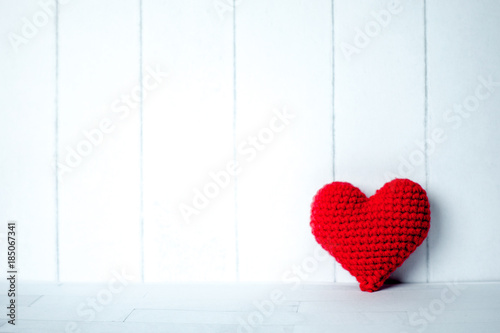 red heart in white room background