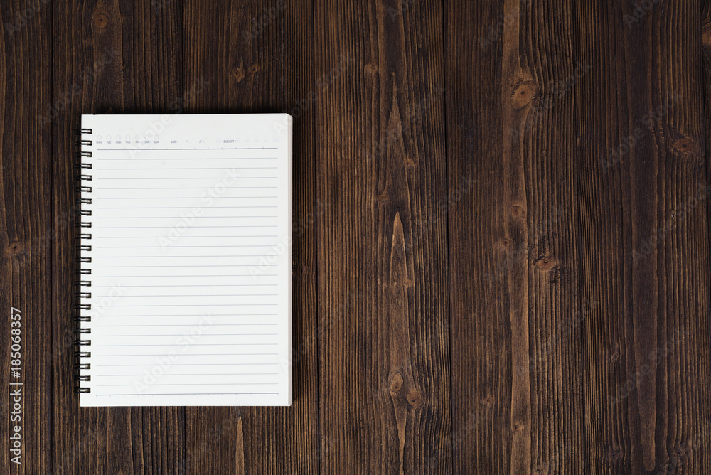 Notebook or empty white paper on wood table top view with copy space, Notebook or empty white paper on wood table top view with copy space,