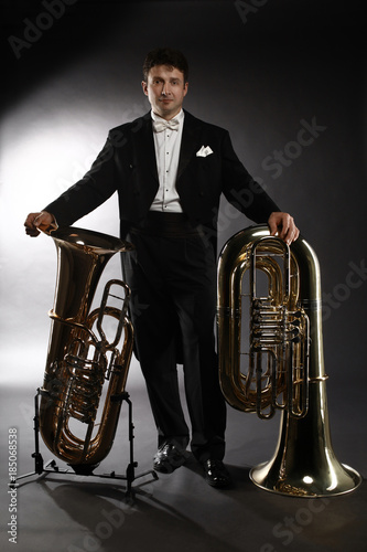 Tuba brass instrument. Classical musician portrait man horn player photo